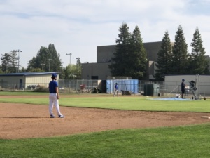 Juniors Ben Hanson and Dylan Rockwell practicing with the varsity baseball team